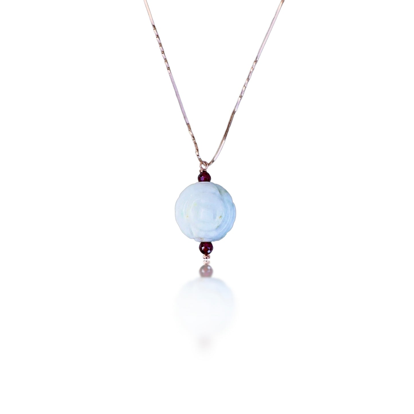 Abundance pendant with Burma jade carving and garnet