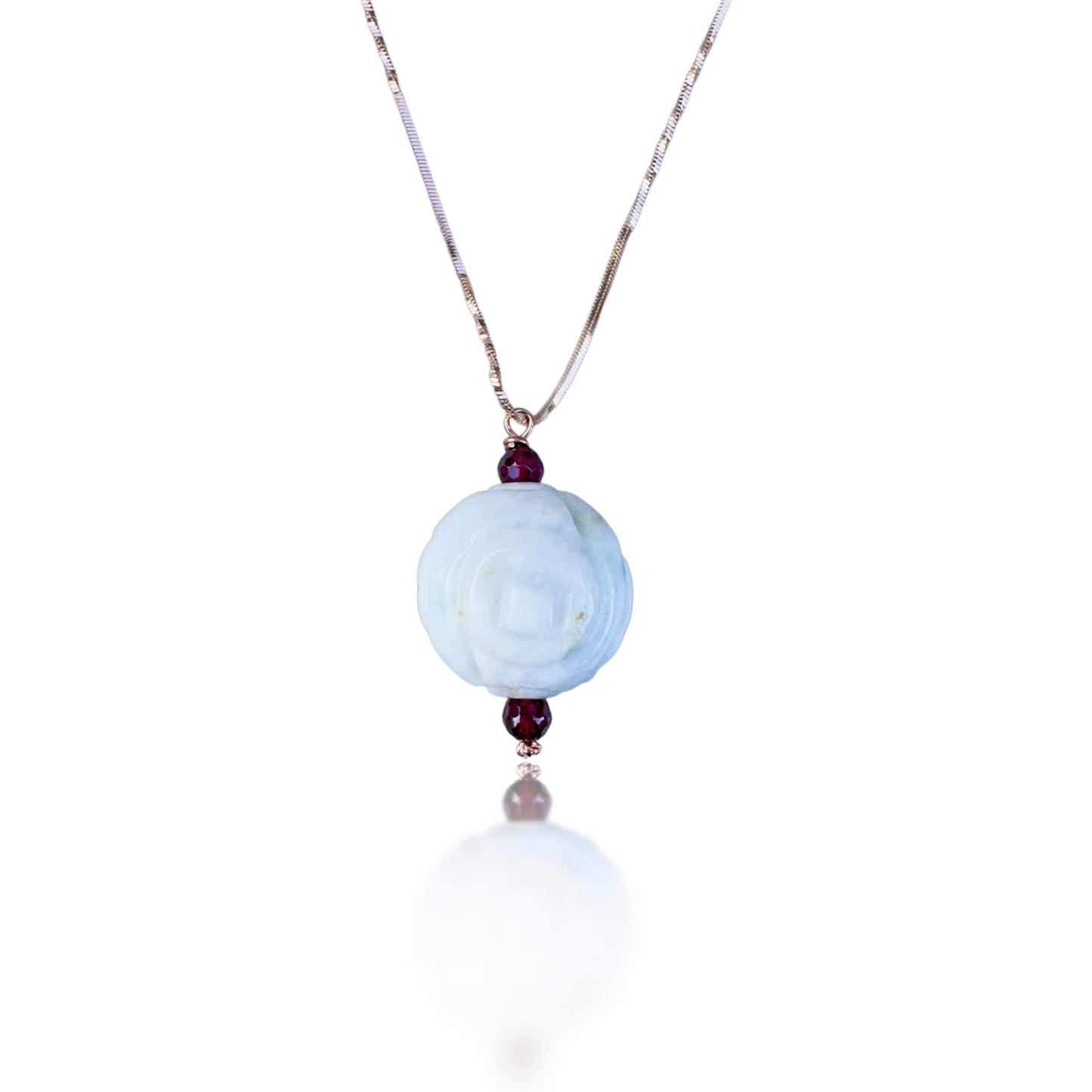 Abundance pendant with Burma jade carving and garnet