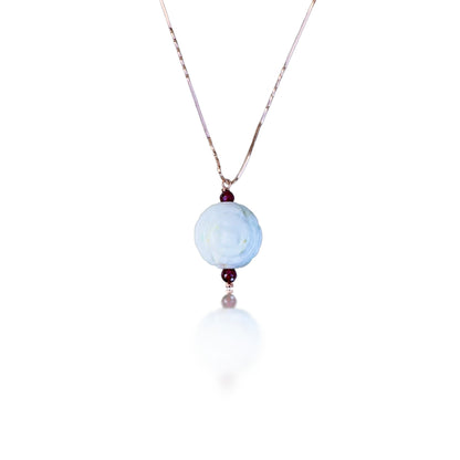 Abundance pendant with Burma jade carving and garnet